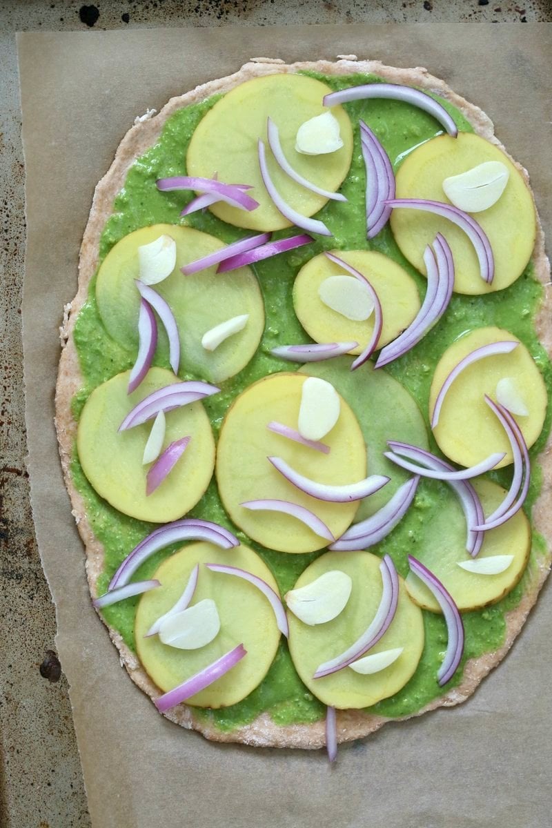 Easy Potato Pesto Pizza with Thin Crust. Basil Spinach Pesto makes for a refreshing Pizza base topping with thin potato slices, onion and garlic. Vegan Pesto Pizza. Bake or make on the grill. Vegan Soyfree Recipe. | VeganRicha.com