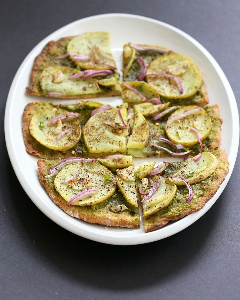 Easy Potato Pesto Pizza with Thin Crust. Basil Spinach Pesto makes for a refreshing Pizza base topping with thin potato slices, onion and garlic. Bake or make on the grill. Vegan Pesto Pizza Soyfree Recipe. | VeganRicha.com