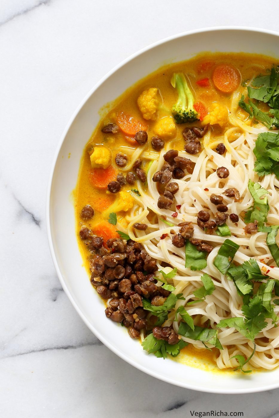 Curry Ramen with Miso Lentils Recipe. Spicy Curry flavored broth, vegetables, noodles, cilantro, basil and maple miso pepper lentils make this a must make vegan ramen. Vegan Gluten-free Soy-free Recipe | VeganRicha.com