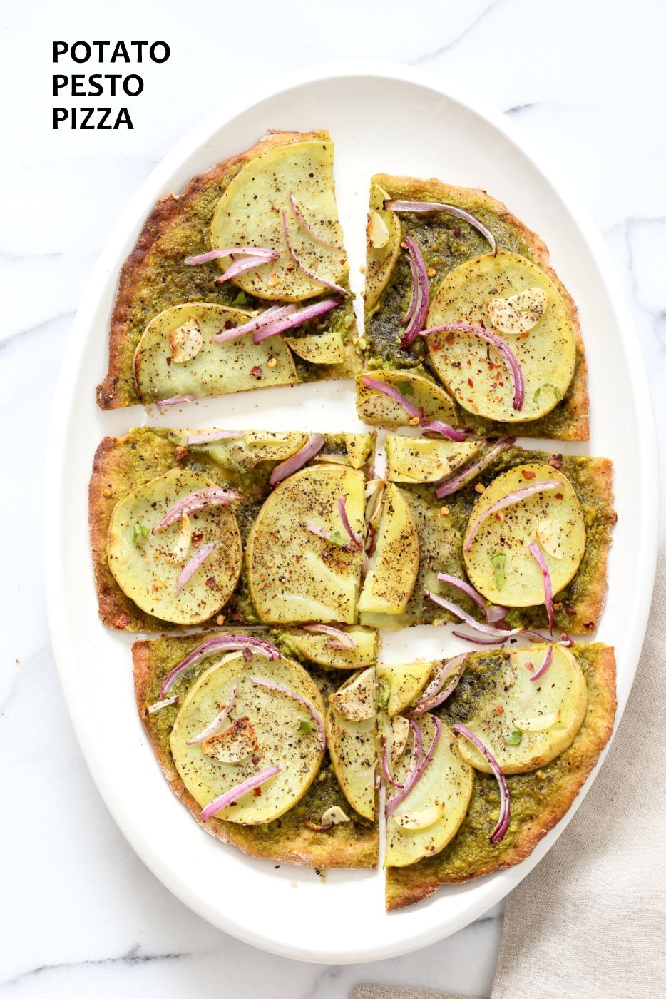 Easy Potato Pesto Pizza with Thin Crust. Basil Spinach Pesto makes for a refreshing Pizza base topping with thin potato slices, onion and garlic. Bake or make on the grill. Vegan Pesto Pizza Soyfree Recipe. | VeganRicha.com
