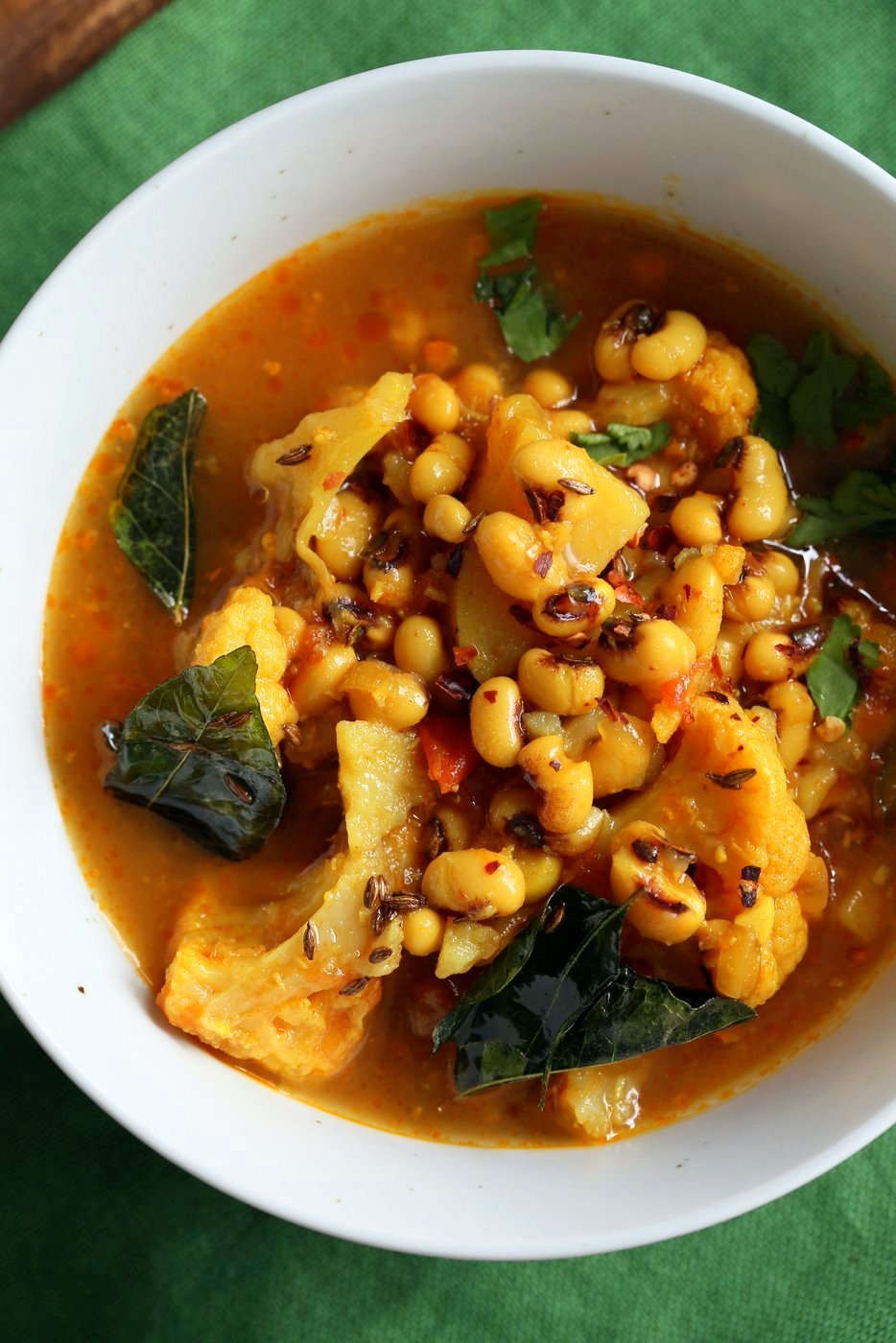 This coconutty Black Eyes Pea stew with Cauliflower and Potatoes is hearty and delicious. Instant Pot Black Eyed Pea Curry with vegetables. Sauepan Option. Vegetarian Black Eyed Peas Recipe | VeganRicha.com