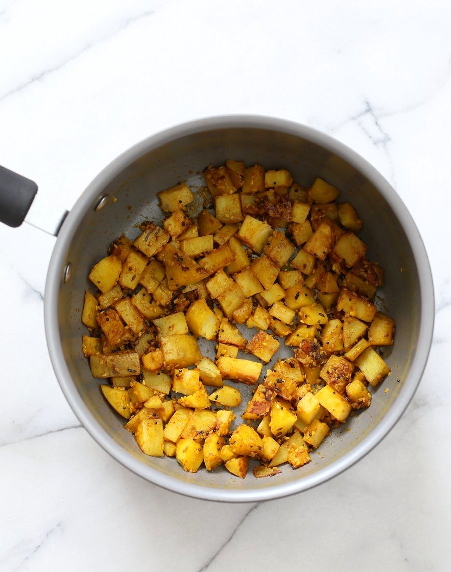 Gujarati Potatoes with Sesame Seeds. Indian Spiced Potatoes with sesame seed and peanuts. Vegan Gluten-free Soy-free Indian Gujarati Recipe. Bateta Nu Shaak | VeganRicha.com