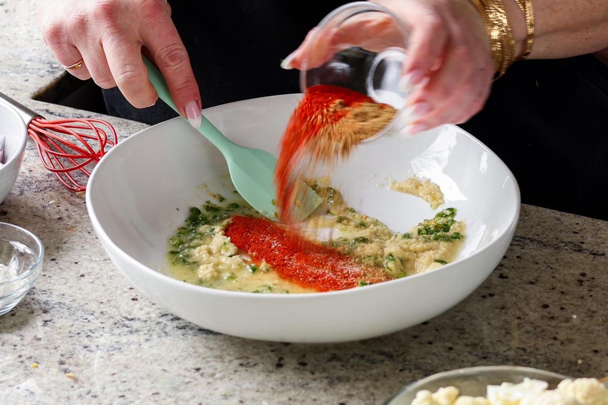 adding ground spices to the marinade