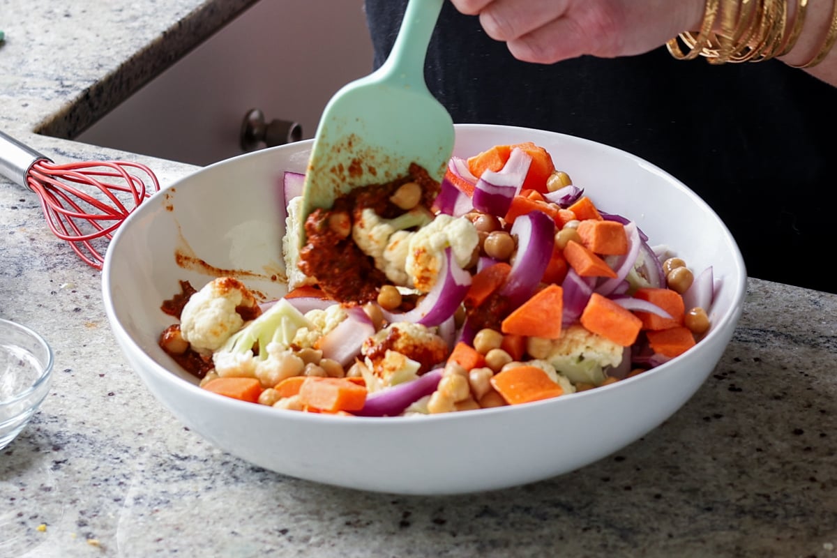 tossing the veggies in the marinade