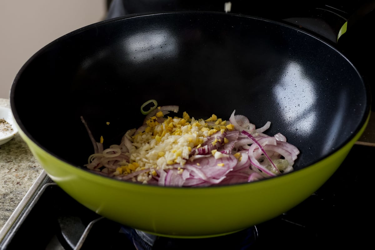 adding the aromatics to the pan