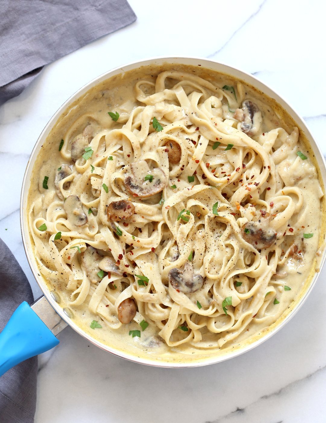 The Best Vegan Mushroom Garlic Alfredo with no nuts. Garlicky, Creamy, Amazing Vegan Fettuccine Alfredo. Nut-free, Easily Gluten-free, soy-free. | VeganRicha.com