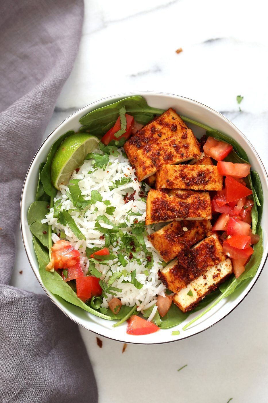 Cajun Tofu with Cilantro Lime Rice. Baked Cajun Spiced Tofu, over greens, cilantro lime rice, and tomatoes. Easy Spicy Bowl. Vegan Gluten-free Nut-free Recipe. Use Chickpea tofu to make soy-free. | VeganRicha.com