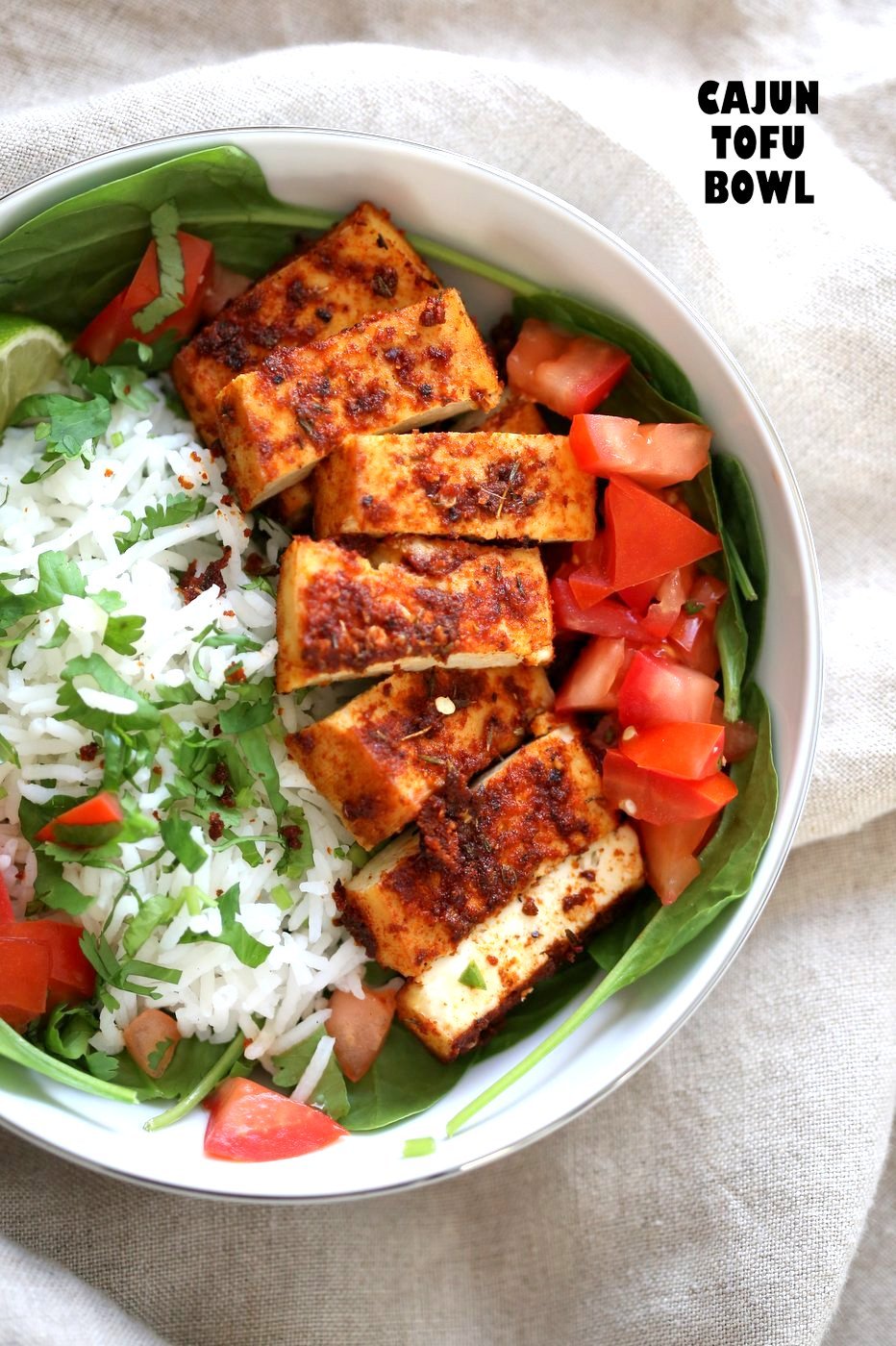 Cajun Tofu with Cilantro Lime Rice. Baked Cajun Spiced Tofu, over greens, cilantro lime rice, and tomatoes. Easy Spicy Bowl. Vegan Gluten-free Nut-free Recipe. Use Chickpea tofu to make soy-free. | VeganRicha.com