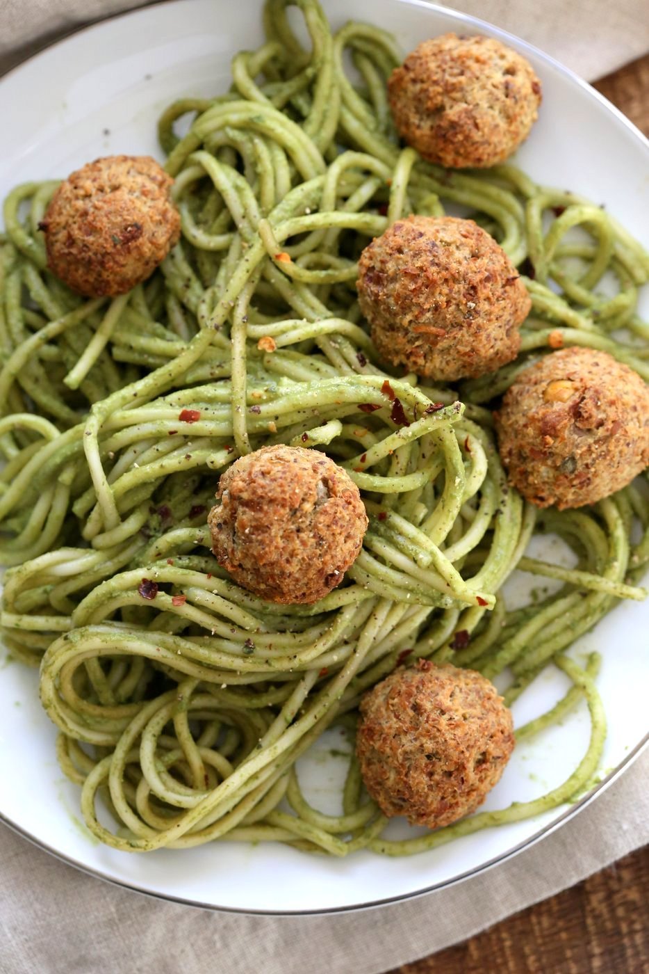 Amazing Pesto Spaghetti with Vegan Meatballs made with Chickpeas. Vegetarian Chickpea Walnut "meatballs" over pesto pasta. Ready in 40 Minutes. Vegan Soyfree Recipe. Can be Glutenfree | VeganRicha.com