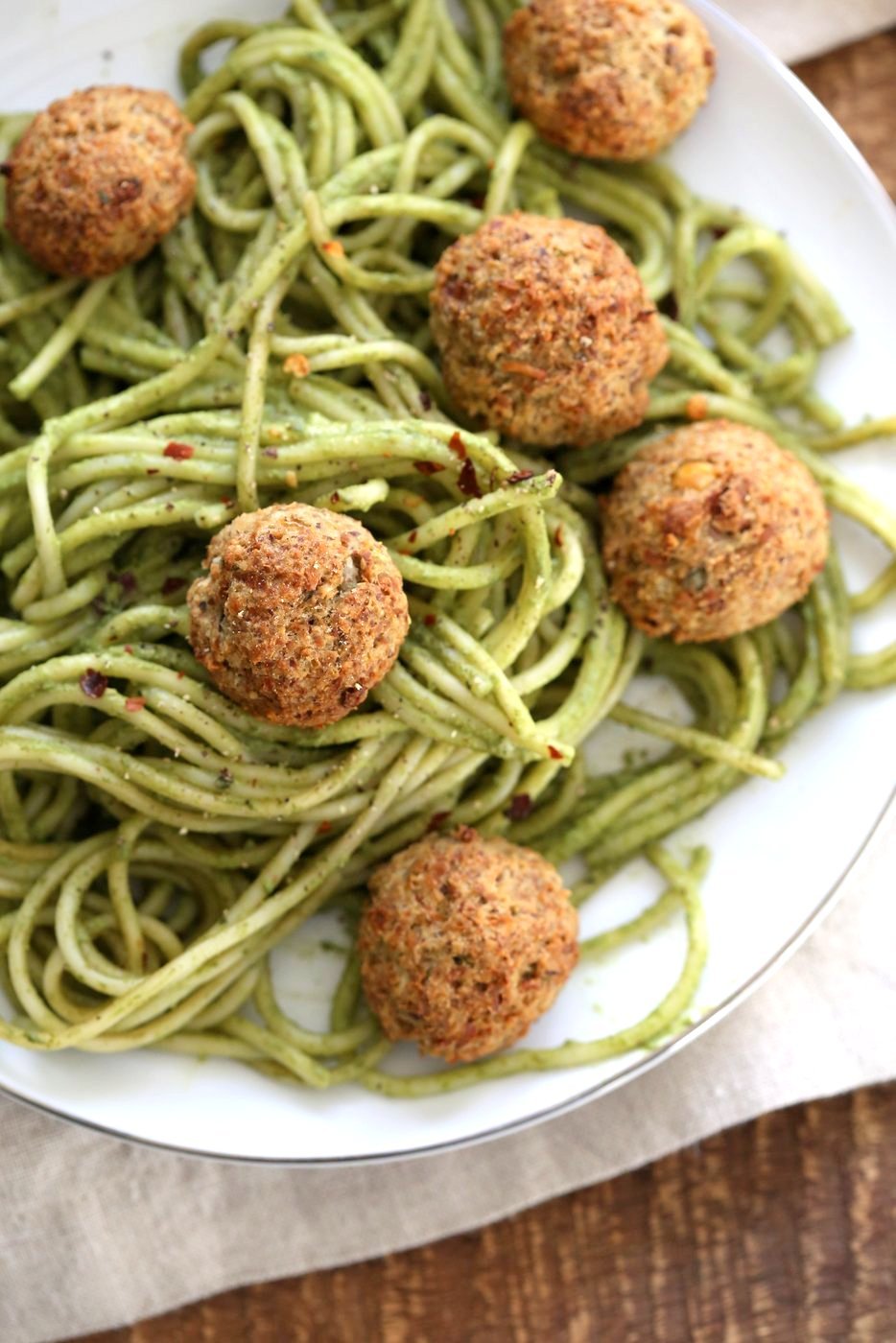 Amazing Pesto Spaghetti with Vegan Meatballs made with Chickpeas. Vegetarian Chickpea Walnut "meatballs" over pesto pasta. Ready in 40 Minutes. Vegan Soyfree Recipe. Can be Glutenfree | VeganRicha.com