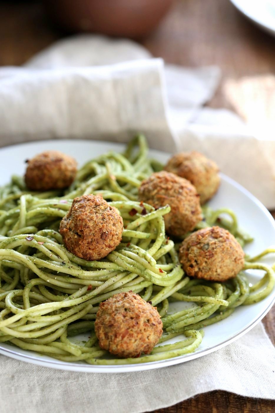 Amazing Pesto Spaghetti with Vegan Meatballs made with Chickpeas. Vegetarian Chickpea Walnut "meatballs" over pesto pasta. Ready in 40 Minutes. Vegan Soyfree Recipe. Can be Glutenfree | VeganRicha.com