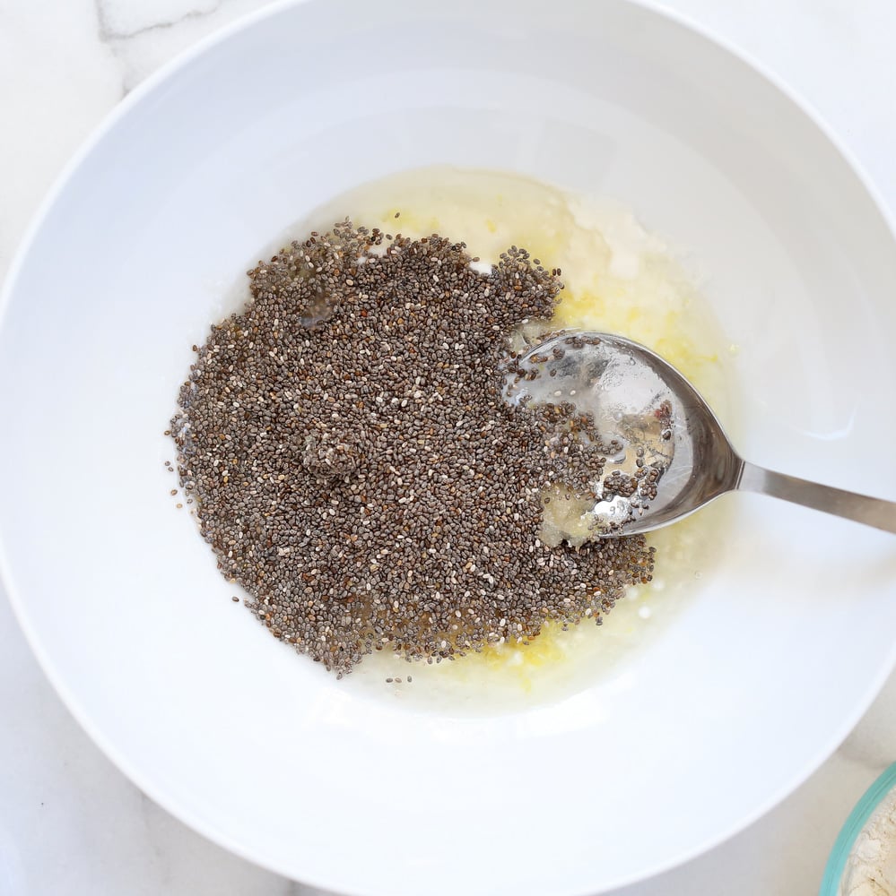 Vegan Lemon Cookie Prep with wet ingredients and chia seeds in a while bowl