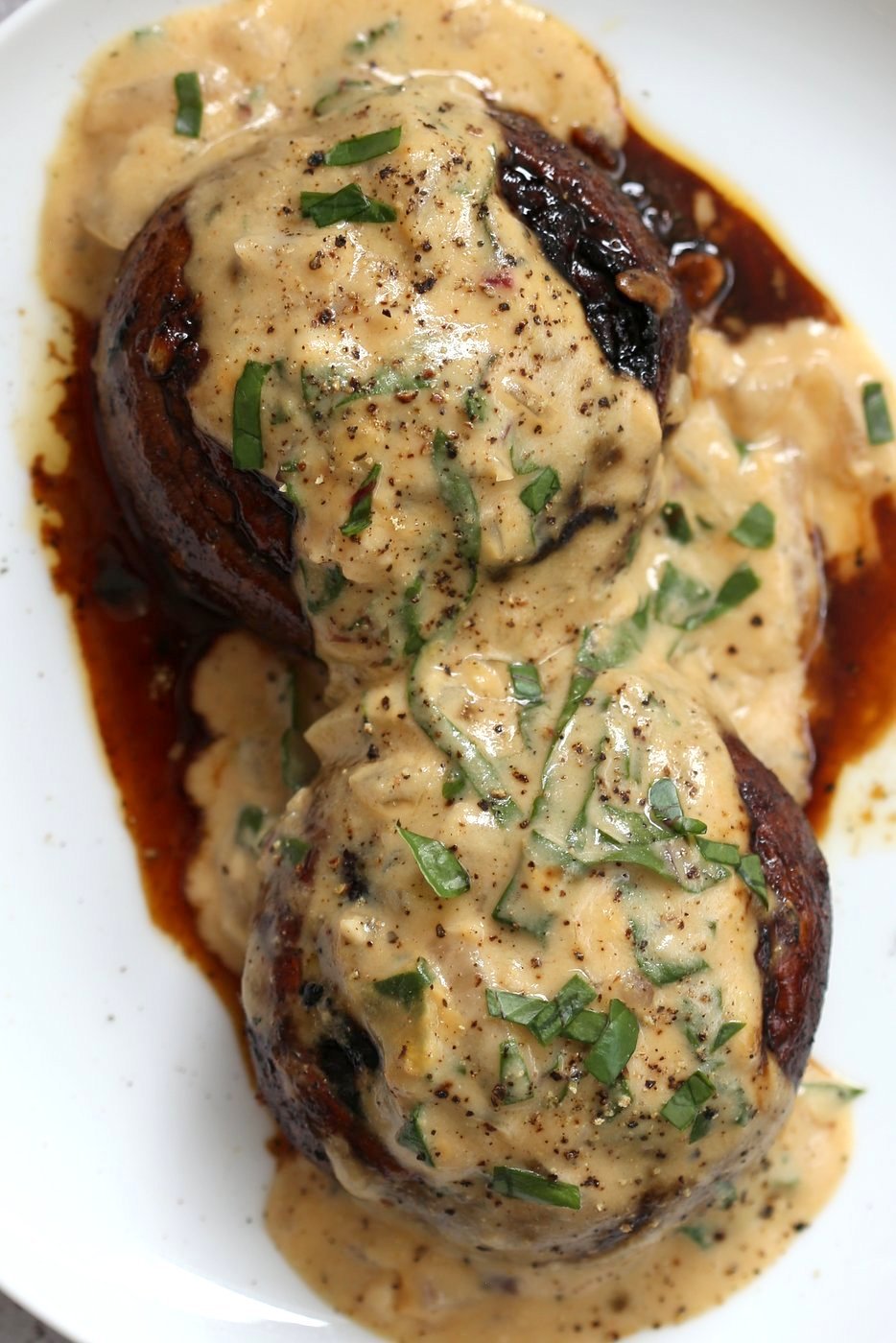 Grilled Portobello Mushrooms with Garlic Sauce. Grilled or Baked Marinated Portabella Mushrooms served with creamy gravy. #Vegan #Glutenfree #Recipe #veganricha | VeganRicha.com