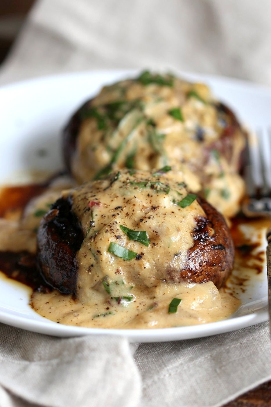 Grilled Portobello Mushrooms with Garlic Sauce. Grilled or Baked Marinated Portabella Mushrooms served with creamy gravy. #Vegan #Glutenfree #Recipe #veganricha | VeganRicha.com