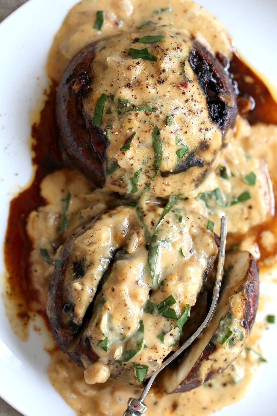 Grilled Portobello Mushrooms with Garlic Sauce. Grilled or Baked Marinated Portabella Mushrooms served with creamy gravy. #Vegan #Glutenfree #Recipe #veganricha | VeganRicha.com