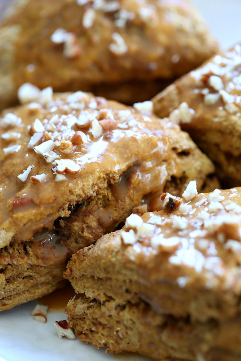 Vegan Pumpkin Scones with Spiced Pumpkin Caramel Glaze Oil-free. These Easy Scones use coconut cream instead of oil and make for a great breakfast with the pumpkin glaze. #Vegan #Recipe #veganricha | VeganRicha.com