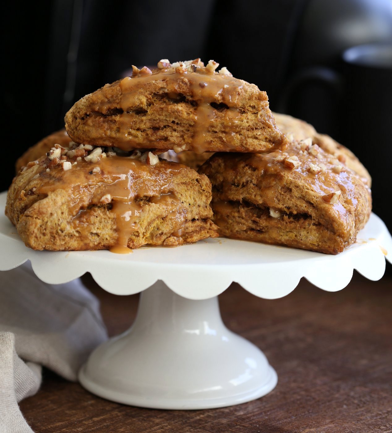 Vegan Pumpkin Scones with Spiced Pumpkin Caramel Glaze Oil-free. These Easy Scones use coconut cream instead of oil and make for a great breakfast with the pumpkin glaze. #Vegan #Recipe #veganricha | VeganRicha.com