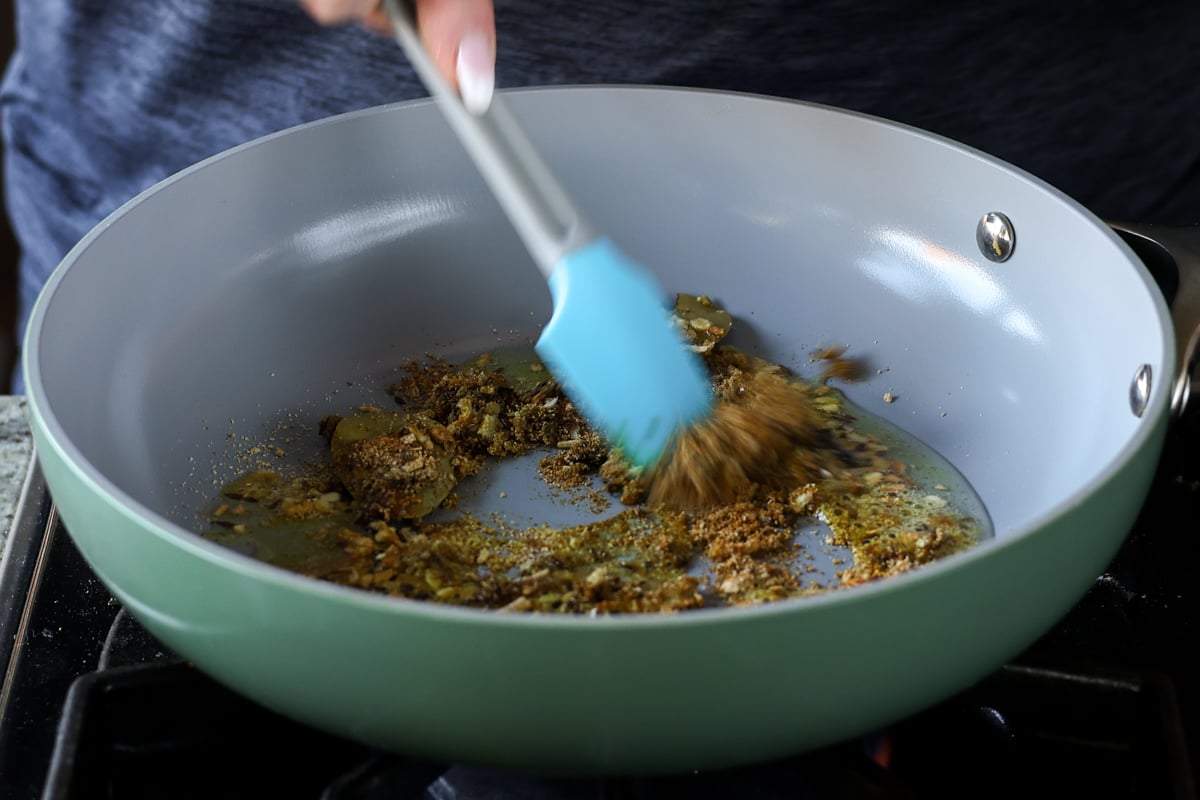 mixing spices in the pan