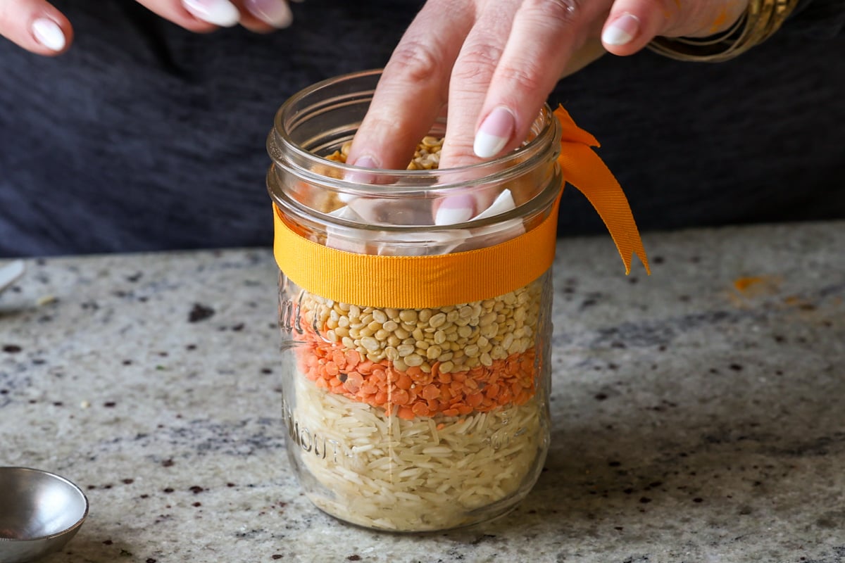 adding spice pouch to the jar