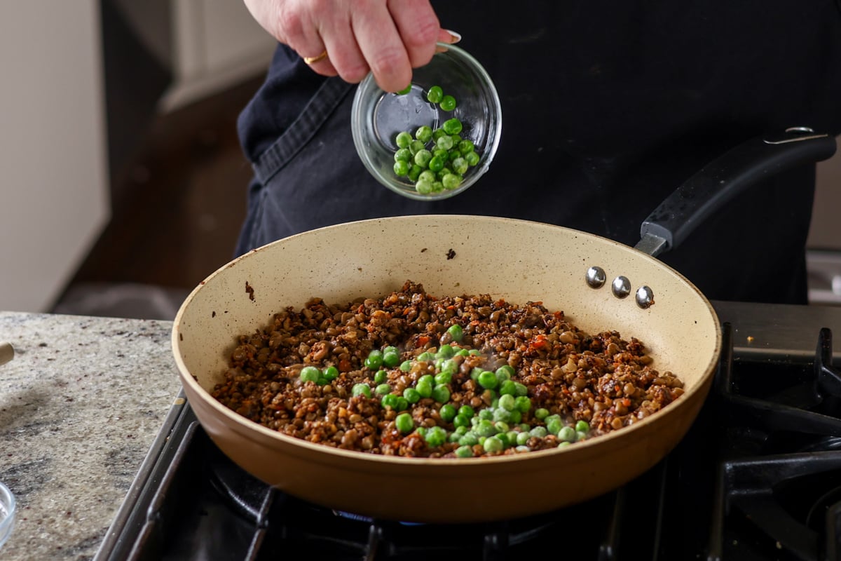 adding peas to the mixture