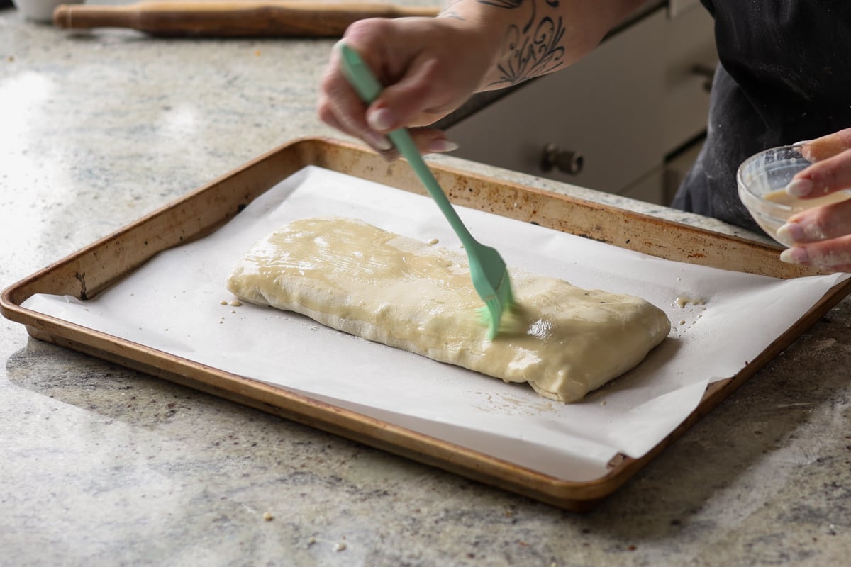 brushing on the pastry wash