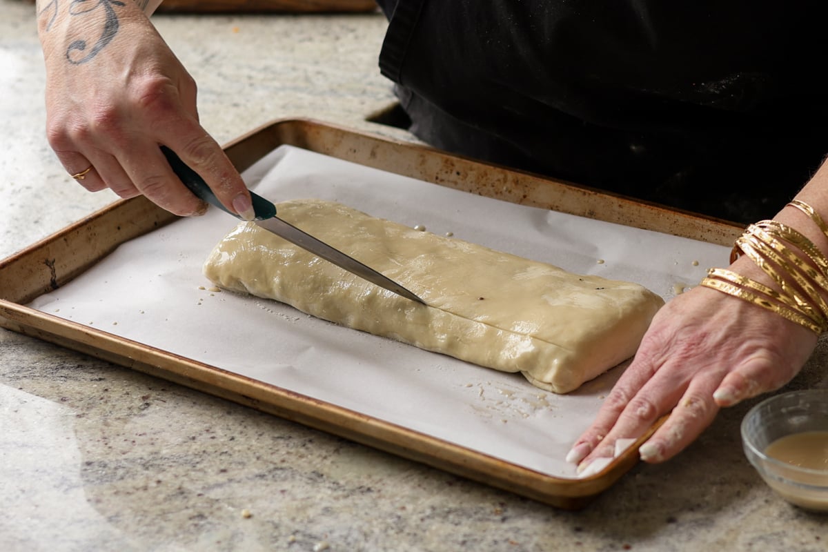 slicing vents into the puff pastry with a knife