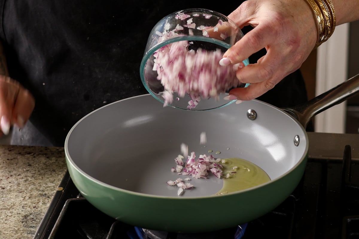 adding onion to the pan
