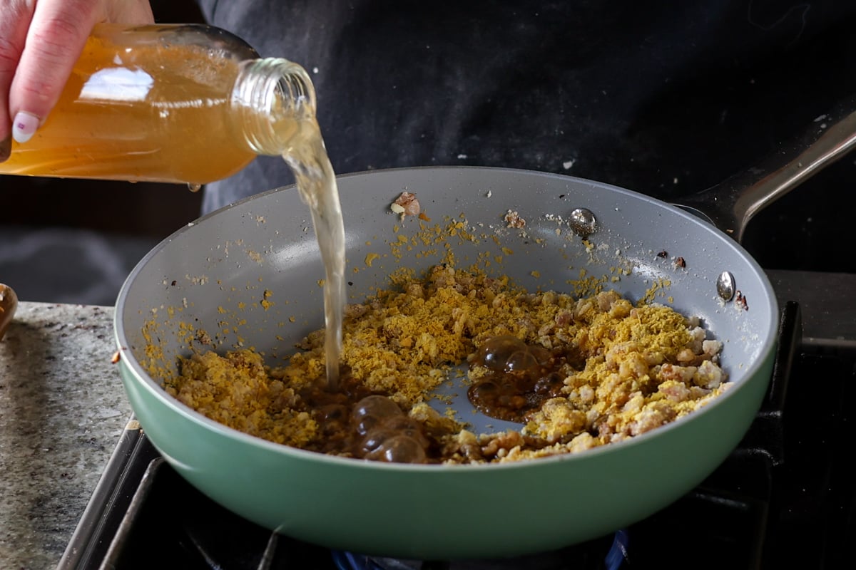 adding stock to the gravy