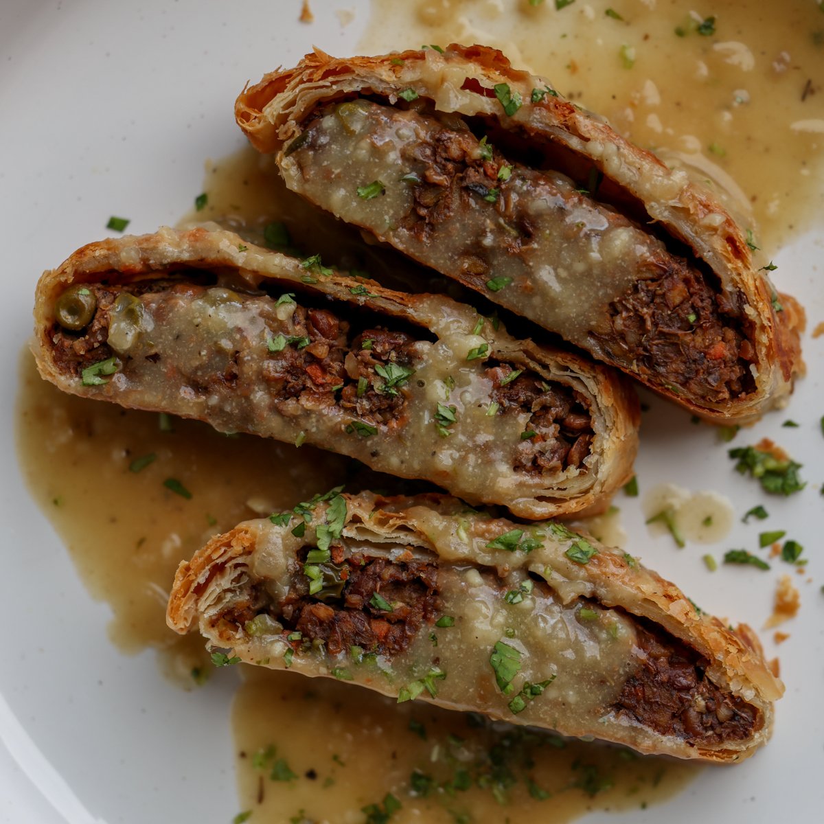 lentil wellington on a plate with gravy