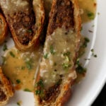 close-up of lentil wellington on a plate with gravy
