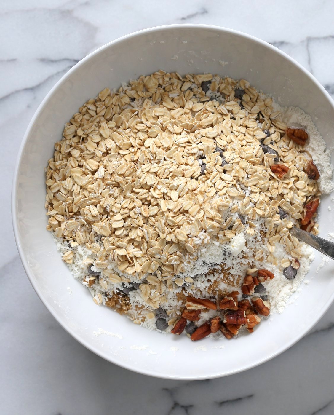 Vegan Cowboy Cookies Mix makes great Jar gifts for the Holiday Season. Layer oats, flour, coconut, chocolate sugar and pecans. Mix, add applesauce and oil, and bake. #veganricha #Vegan #Recipe Can be #glutenfree. | VeganRicha.com