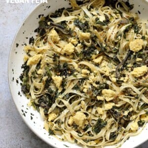 Fettuccine with Caramelized Onions, Greens and Vegan Feta - ish cheese. Easy Weeknight meal. Make the cheese ahead, then the dish is 1 Pot and 30 minutes. #Vegan, can be Gluten-free, Soy-free #veganricha | VeganRicha.com
