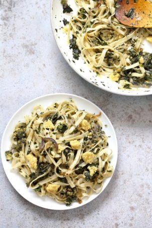 Fettuccine with Caramelized Onions, Greens and Vegan Feta - ish cheese. Easy Weeknight meal. Make the cheese ahead, then the dish is 1 Pot and 30 minutes. #Vegan, can be Gluten-free, Soy-free #veganricha | VeganRicha.com