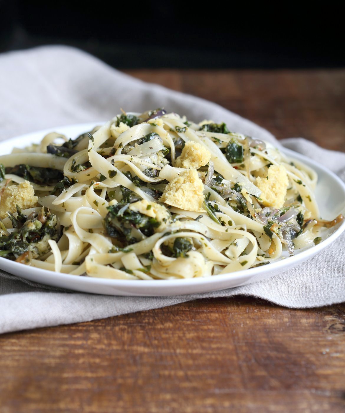 Fettuccine with Caramelized Onions, Greens and Vegan Feta - ish cheese. Easy Weeknight meal. Make the cheese ahead, then the dish is 1 Pot and 30 minutes. #Vegan, can be Gluten-free, Soy-free #veganricha | VeganRicha.com