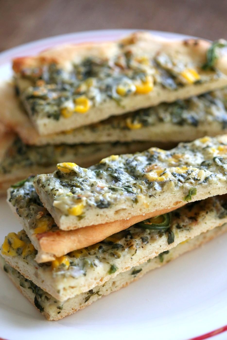 Vegan Spinach Dip Breadsticks. Creamy Corn and Spinach dip spread over pizza crust or puff pastry, bake, slice and serve. Easy Vegan Recipe. Can be gluten-free if served as a dip #vegan #veganricha #recipe #spinachdip | VeganRicha.com