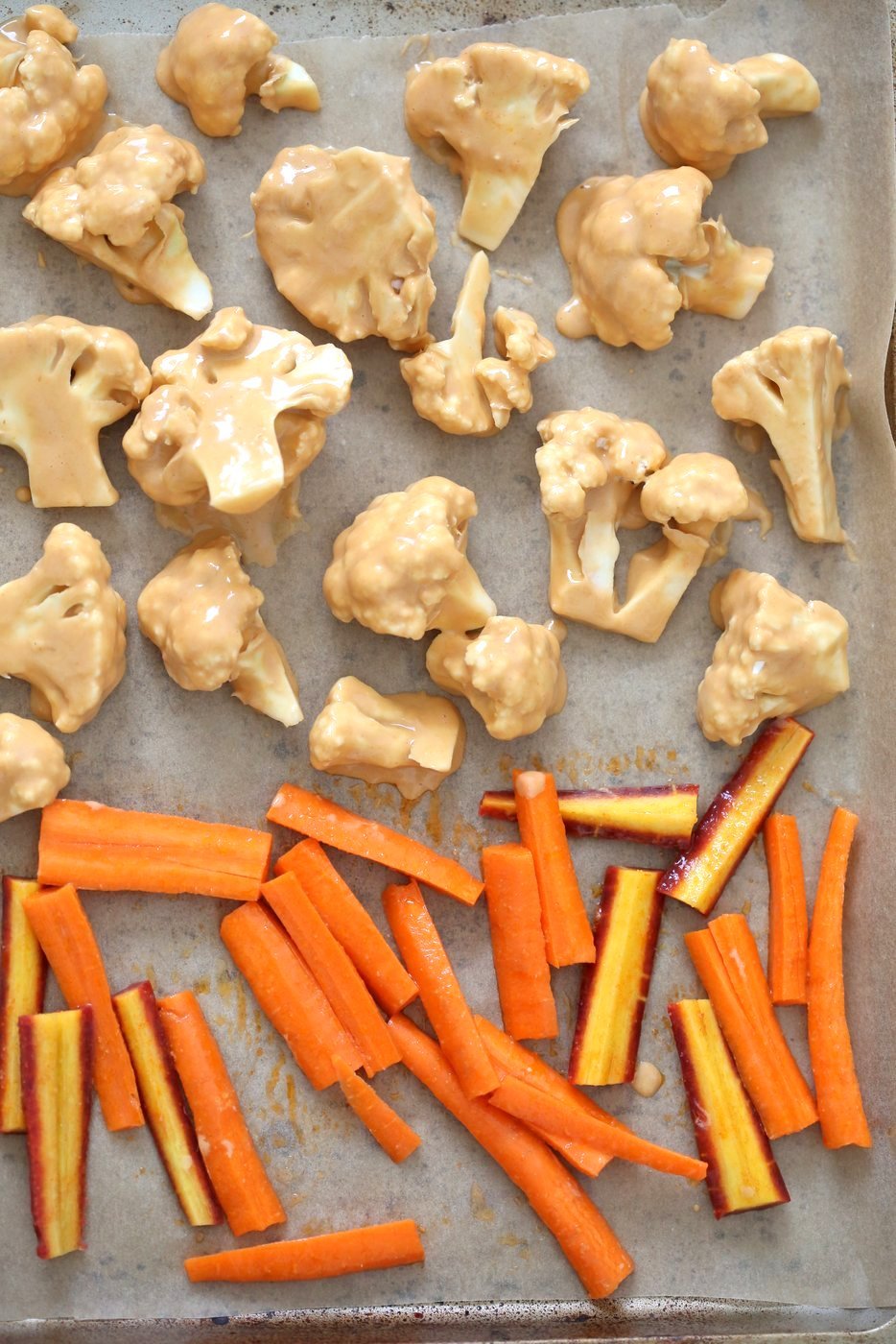 Peanut Butter Cauliflower Bowl with Roasted Carrots. Cauliflower tossed in peanut butter sauce and roasted, carrots tossed in hot sauce and roasted. Vegan Recipe, Gluten-free Recipe.  | VeganRicha.com