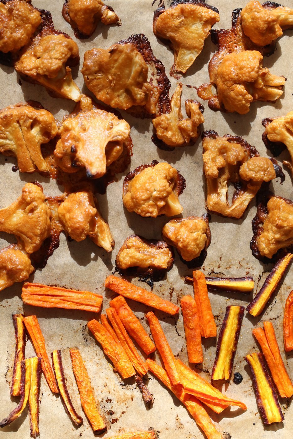 Peanut Butter Cauliflower Bowl with Roasted Carrots. Cauliflower tossed in peanut butter sauce and roasted, carrots tossed in hot sauce and roasted. Vegan Recipe, Gluten-free Recipe.  | VeganRicha.com
