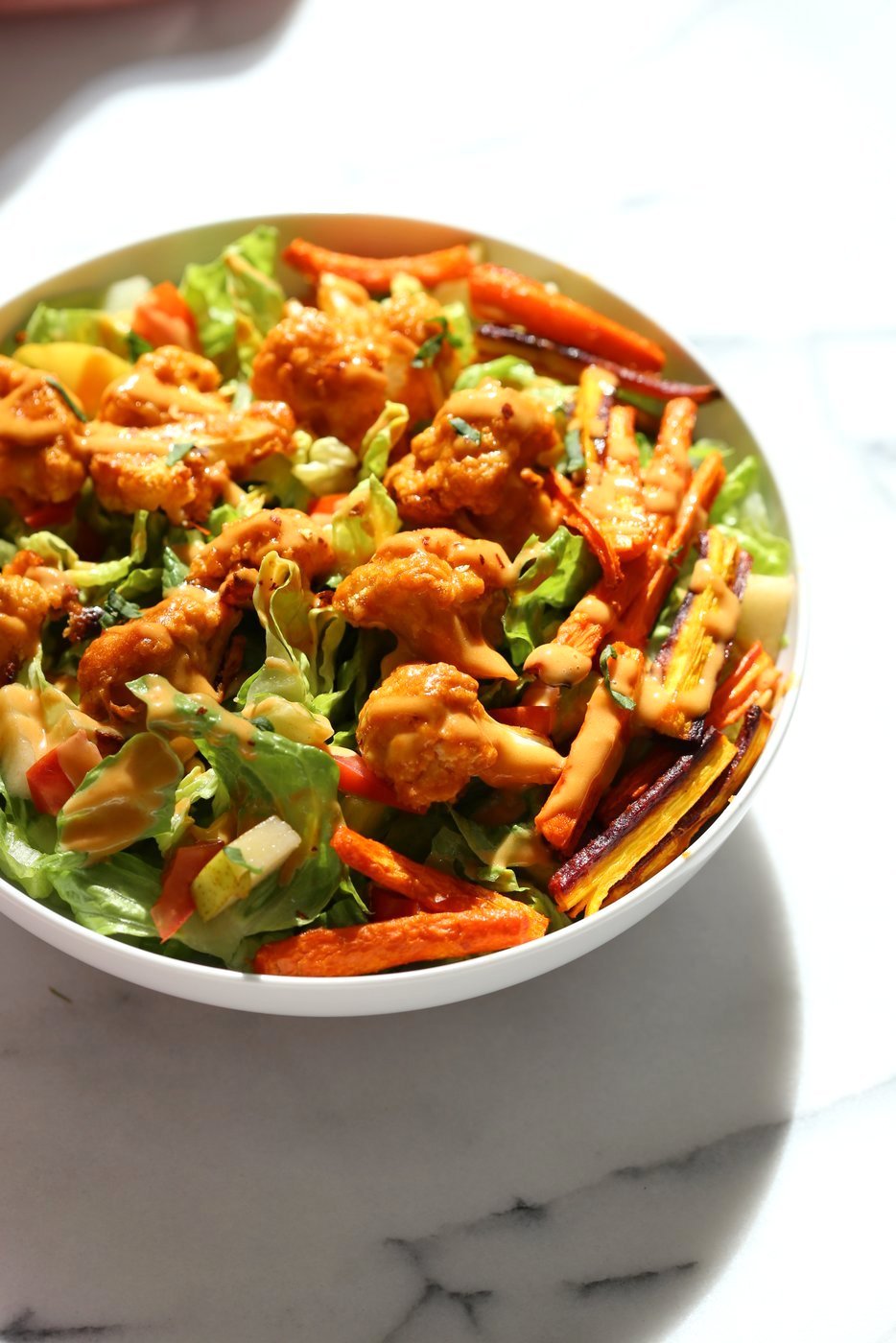 Peanut Butter Cauliflower Bowl with Roasted Carrots. Cauliflower tossed in peanut butter sauce and roasted, carrots tossed in hot sauce and roasted. Vegan Recipe, Gluten-free Recipe.  | VeganRicha.com