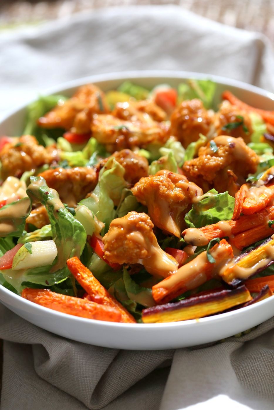 Peanut Butter Cauliflower Bowl with Roasted Carrots. Cauliflower tossed in peanut butter sauce and roasted, carrots tossed in hot sauce and roasted. Vegan Recipe, Gluten-free Recipe.  | VeganRicha.com