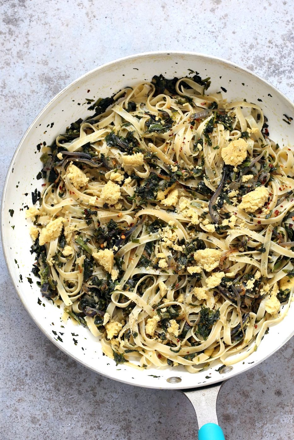 Fettuccine with Caramelized Onions, Greens and Vegan Feta - ish cheese. Easy Weeknight meal. Make the cheese ahead, then the dish is 1 Pot and 30 minutes. #Vegan, can be Gluten-free, Soy-free #veganricha | VeganRicha.com