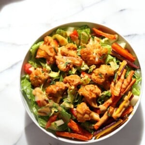 Peanut Butter Cauliflower Bowl with Roasted Carrots. Cauliflower tossed in peanut butter sauce and roasted, carrots tossed in hot sauce and roasted. Vegan Recipe, Gluten-free Recipe.  | VeganRicha.com