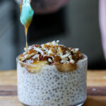 drizzling caramel sauce onto banana chia pudding