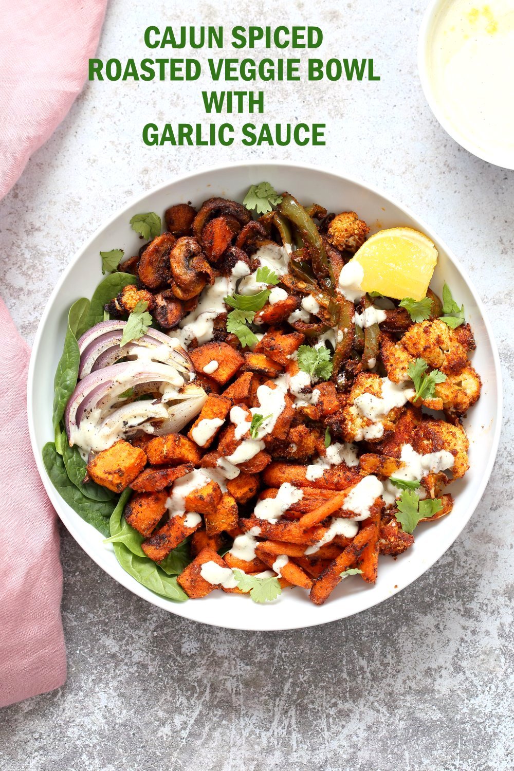 Cajun Roasted Vegetable Bowl with Garlic Sauce. Mushrooms, Cauliflower, Sweet Potato, Peppers, Onions, tossed in cajun spice blend and roasted. Serve in a bowl with crunchy greens and creamy cashew garlic dressing or make wraps or Tacos. #veganricha #Vegan #Glutenfree #Soyfree #Recipe. Can be nut-free. | VeganRicha.com