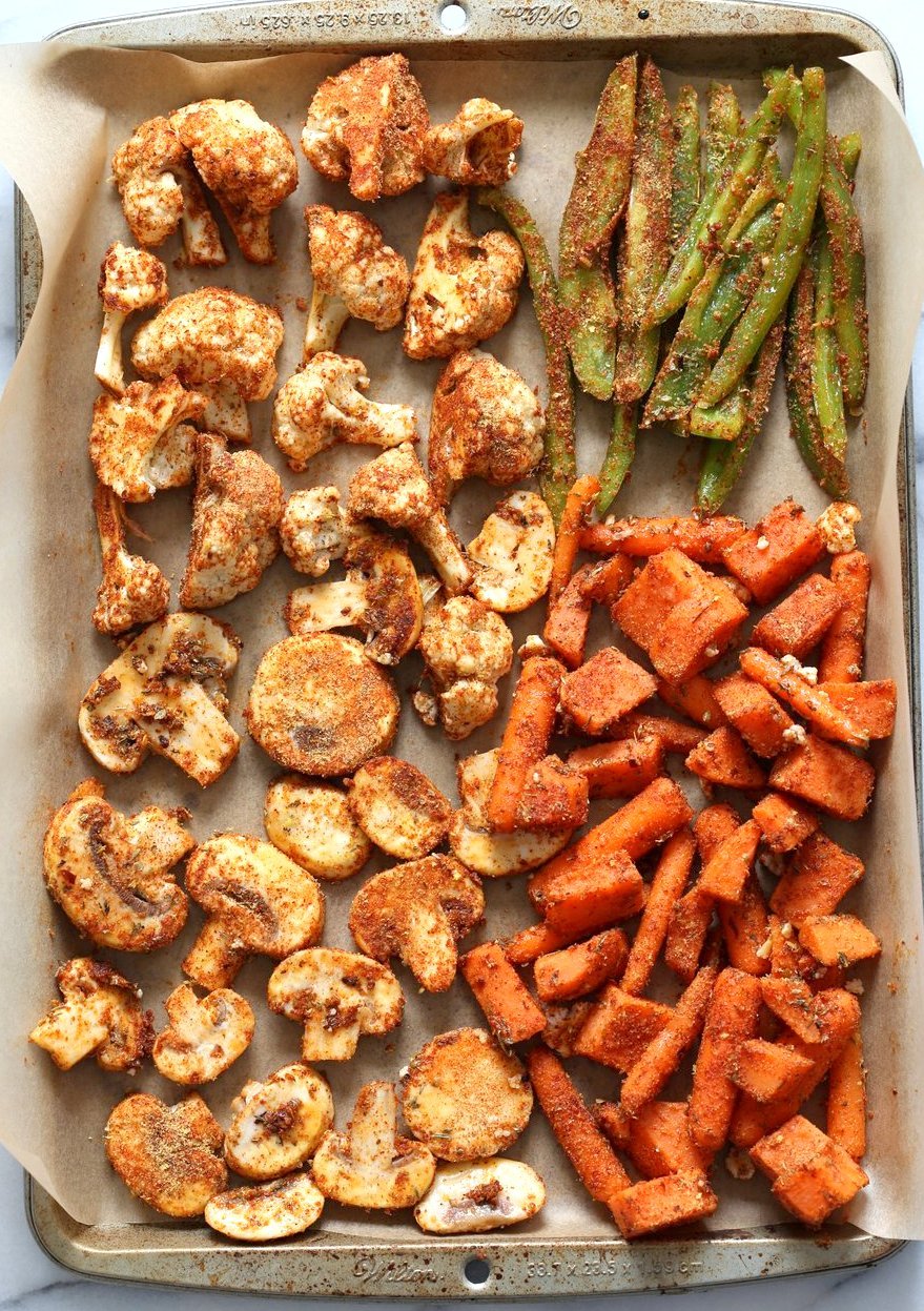 Cajun Roasted Vegetable Bowl with Garlic Sauce. Mushrooms, Cauliflower, Sweet Potato, Peppers, Onions, tossed in cajun spice blend and roasted. Serve in a bowl with crunchy greens and creamy garlic sauce or make wraps or tacos. #veganricha #Vegan #Glutenfree #Soyfree #Recipe. Can be nut-free. | VeganRicha.com