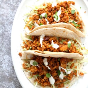 Mango BBQ Soy Curls or Jackfruit Tacos. Shredded Soy Curls or Jackfruit make a an amazing carrier for bbq sauce. Some Mango or other fruit puree takes it to the next level. Serve in sandwiches or tacos with slaw. #Vegan #Glutenfree #Recipe #veganricha | VeganRicha.com