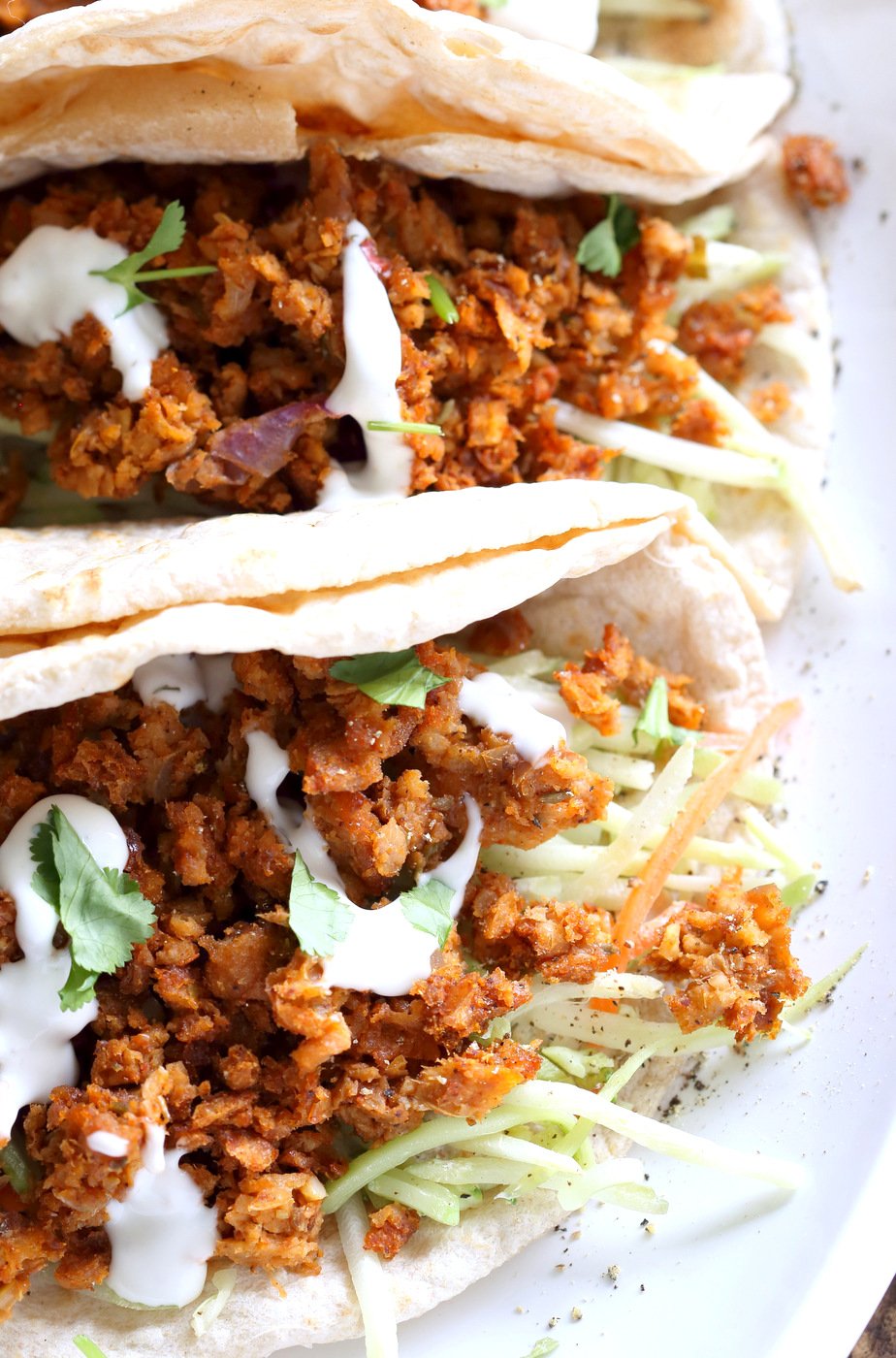 Mango BBQ Soy Curls or Jackfruit Tacos. Shredded Soy Curls or Jackfruit make a an amazing carrier for bbq sauce. Some Mango or other fruit puree takes it to the next level. Serve in sandwiches or tacos with slaw. #Vegan #Glutenfree #Recipe #veganricha | VeganRicha.com