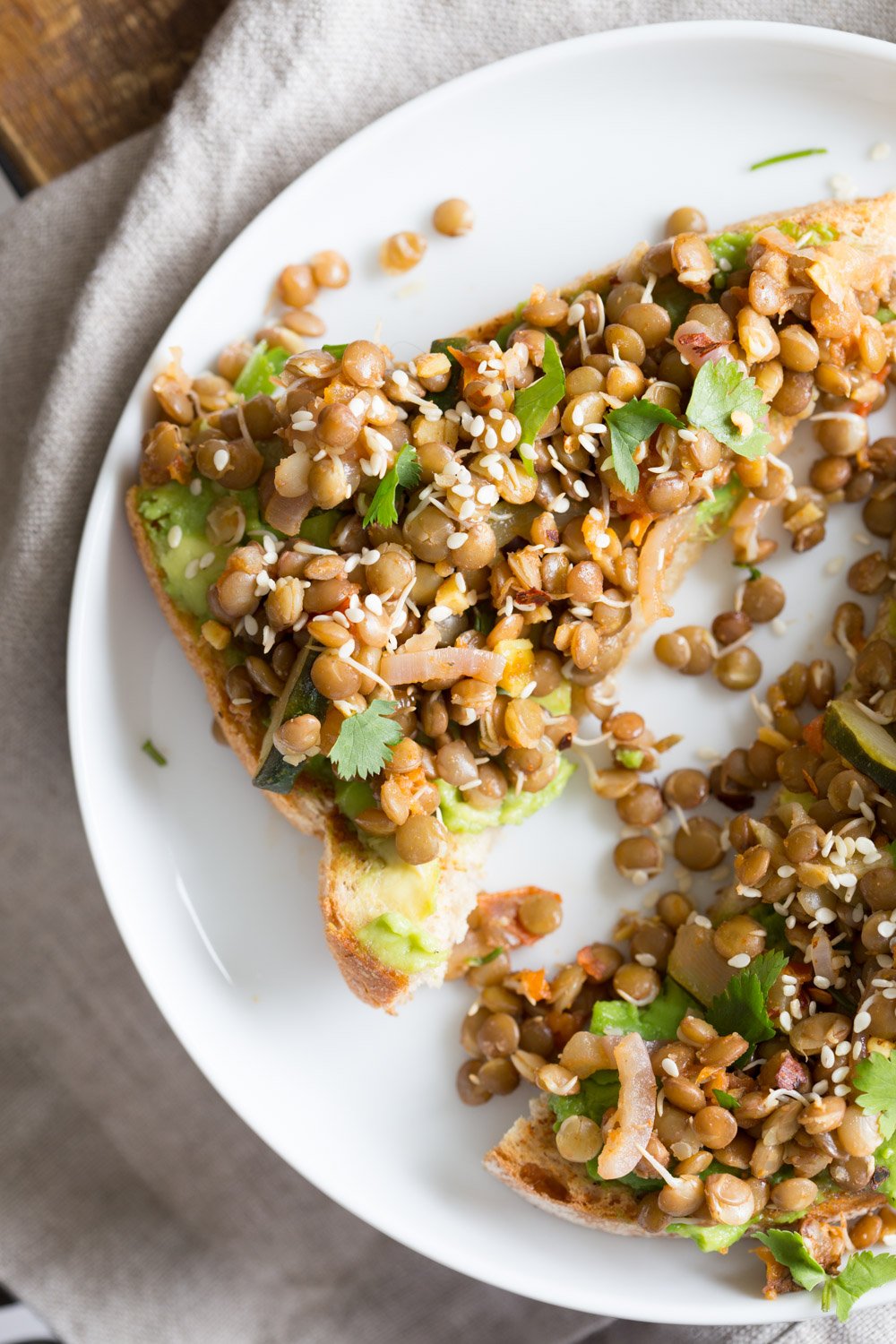 Ginger Coriander Sprouted Lentil Avocado Toast. Sprout Lentils or Mung Beans, Lightly saute with ginger, onion and tomato and serve over Mashed Avocado Toast. #Vegan #veganricha #Nutfree #Soyfree #Recipe | VeganRicha.com