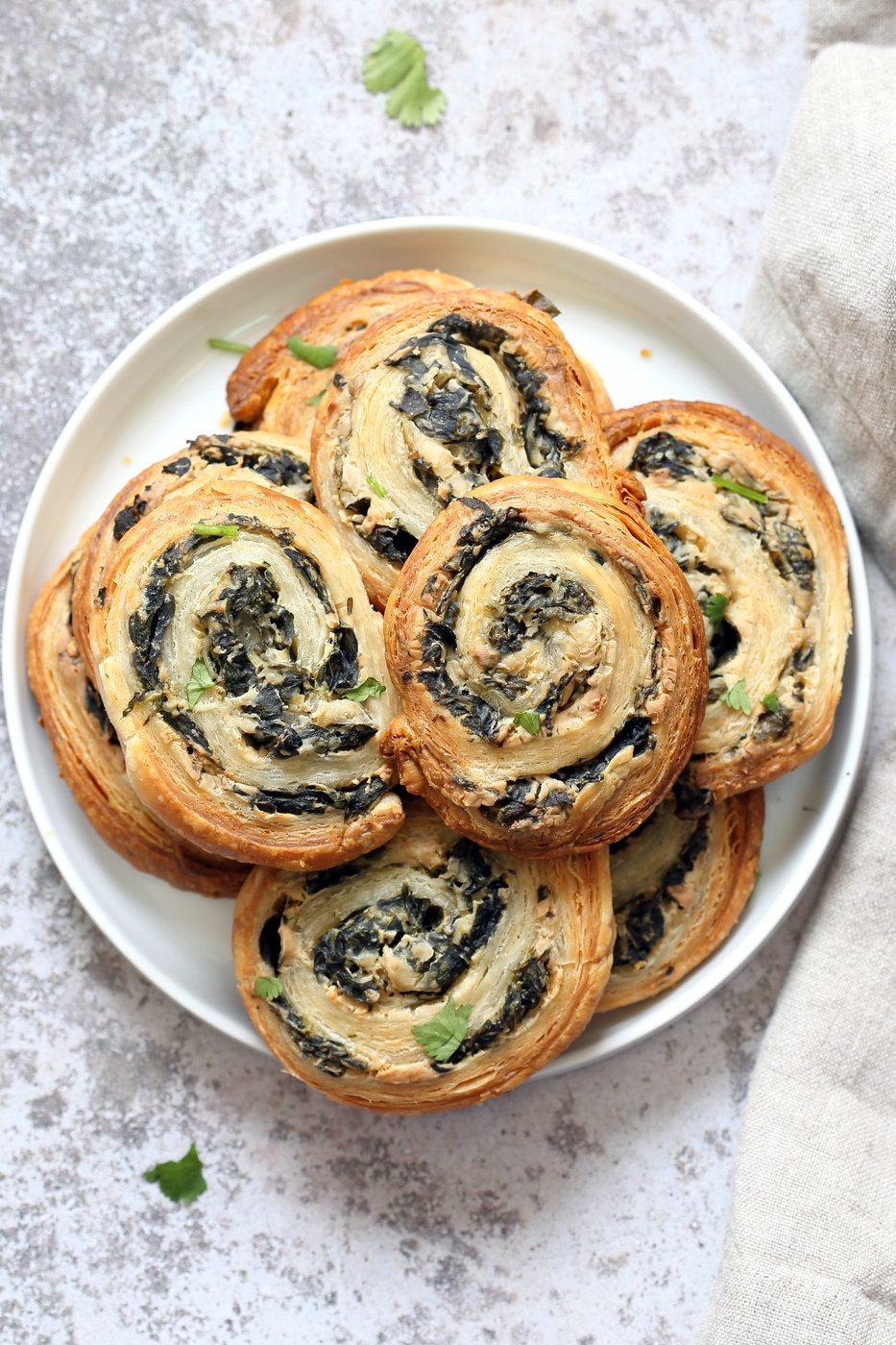 Vegan Spinach Pinwheels. Creamy cheesy Spinach dip spread on puff pastry, rolled, sliced and baked to make a great Snack. #Vegan #Soyfree #Recipe #veganricha | VeganRicha.com