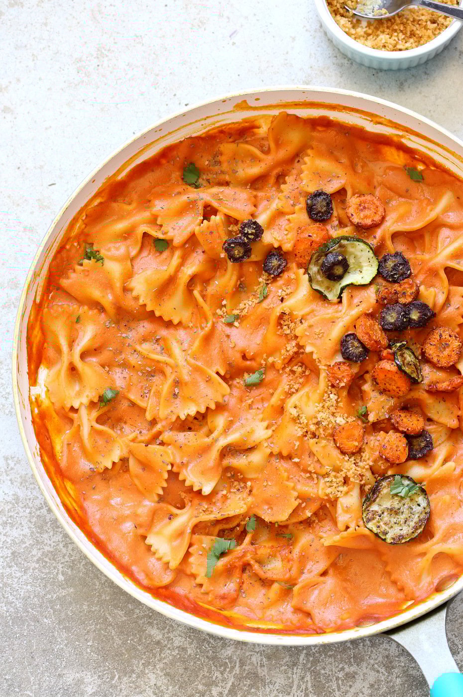 Vegan Rose Sauce Farfalle Pasta with Roasted Veggies in a white saucepan
