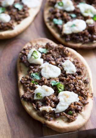 Vegan Keema Naan with Keema Lentils, onion, carrots and walnuts. These lentils with the herbs and spices make a vegan version of keema. Serve over Naan bread or Pizza or fill tacos or wraps. #Vegan #Recipe #veganricha, Can be gluten-free and soy free.ย | VeganRicha,com